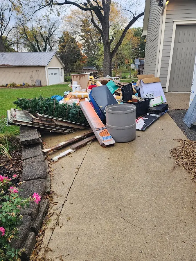 Dumpster being loaded with debris for 30 Yard Dumpster Rental in Barrington